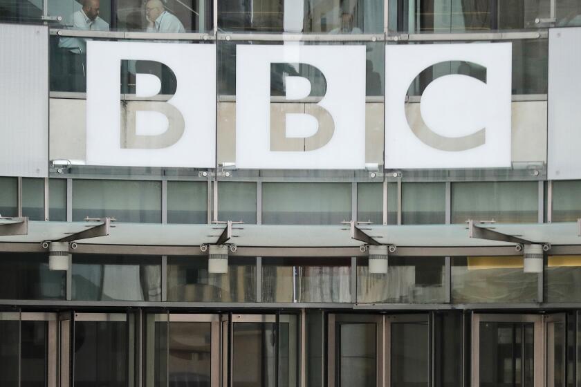 FILE - The BBC sign outside the entrance to the headquarters of the publicly funded media organisation in London, July 19, 2017. Russians could face prison sentences of up to 15 years for spreading information that goes against the government’s position on the war in Ukraine. The move on Friday March 4, 2022, came as Russian authorities blocked access to foreign media that publish in Russian reports. The blocks affect the BBC, the U.S. government-funded Voice of America and Radio Free Europe/Radio Liberty, German broadcaster Deutsche Welle and Latvia-based website Meduza. (AP Photo/Frank Augstein, File)