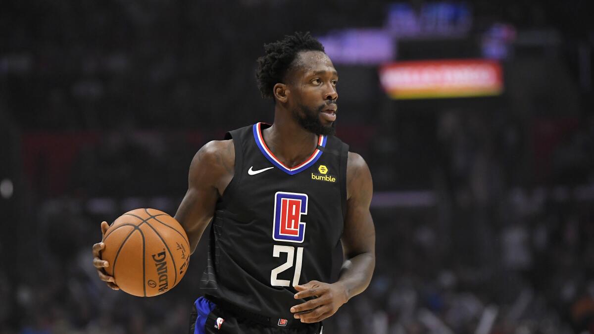 Clippers guard Patrick Beverley dribbles during the second half against the Denver Nuggets on Feb. 28 at Staples Center.