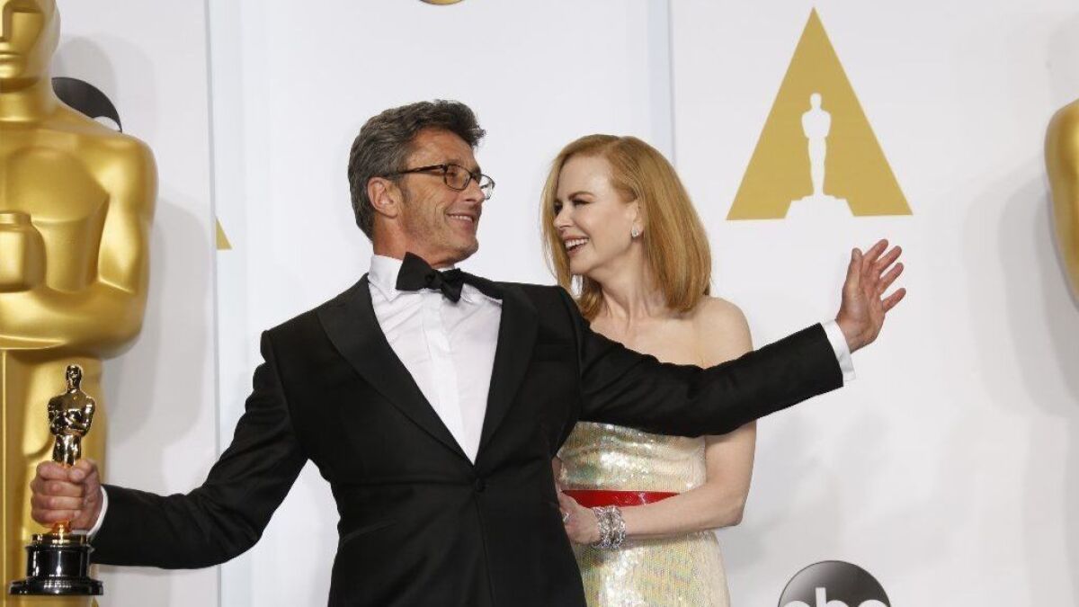 Director Pawel Pawlikowski on the night of his foreign-language Oscar win. He's with presenter Nicole Kidman in the backstage photo room on Feb. 22, 2015.