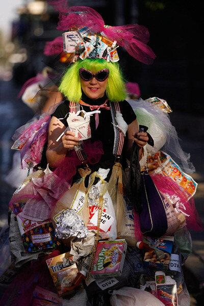 A woman dressed as a 'Dumpster Diva' walks though the French Quarter on Mardi Gras.