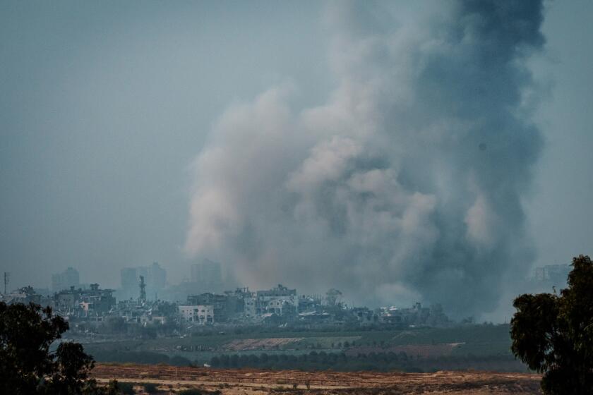 SDEROT, ISRAEL -- OCTOBER 28, 2023: Plumes of smoke could be seen from the detritus of Israeli bombardment as it picks up in intensity after military officials announced an expanded ground operation into the Gaza Strip to eliminate Hamas, as seen from Sderot, Israel, Saturday, Oct. 28, 2023. (MARCUS YAM / LOS ANGELES TIMES)