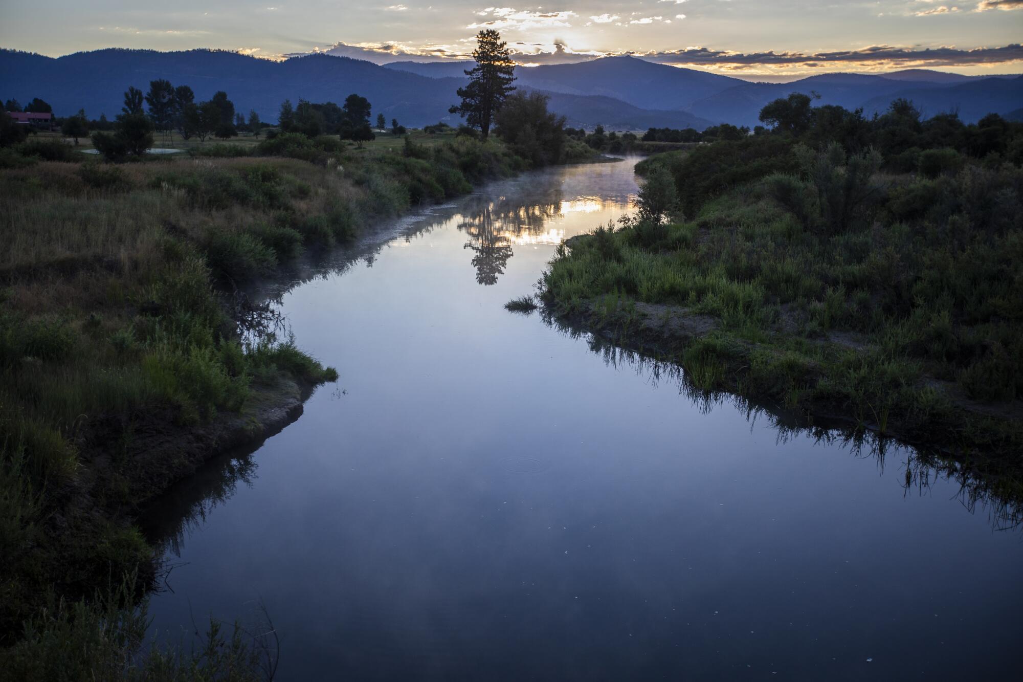 At dawn, steam rises from calm Indian Creek between Crescent Mills and Taylorsville. 