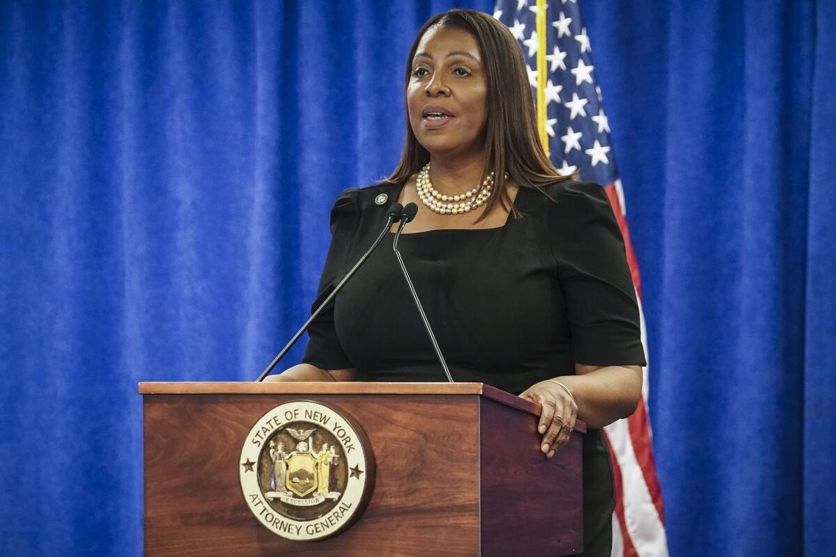 New York Atty. Gen. Letitia James speaks at a lectern.