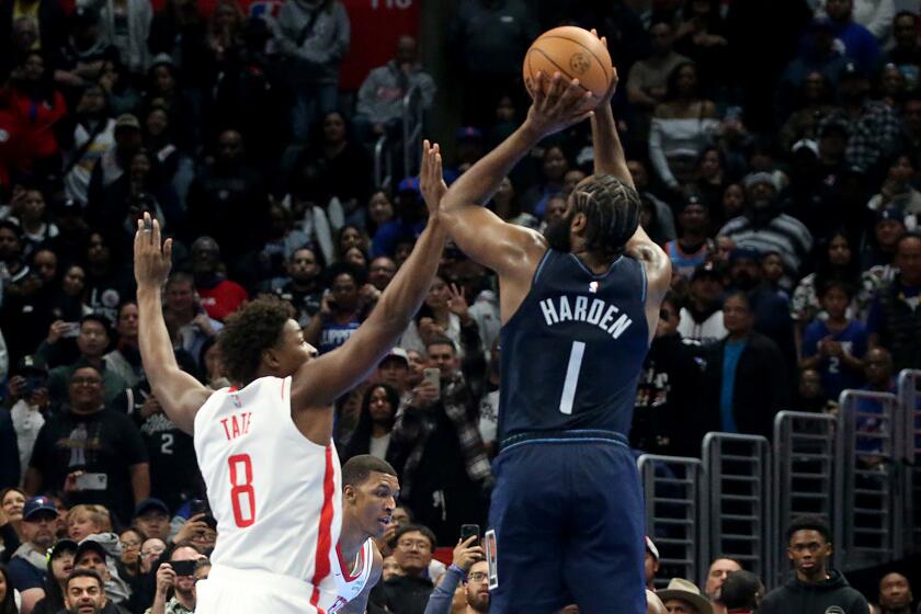 Los Angeles, CA - Clippers guard James Harden shoots and scores a three-pointer.
