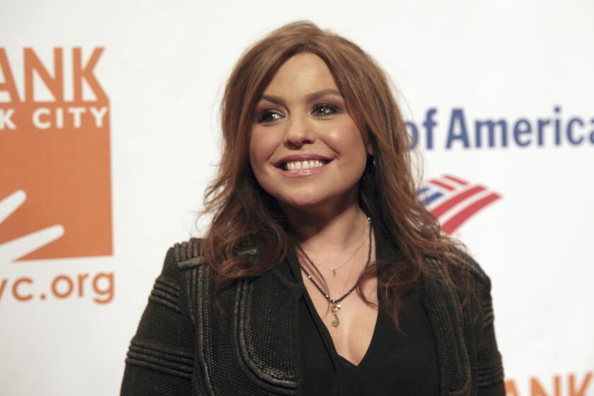 FILE - In this April 9, 2014 file photo, Rachel Ray attends the Food Bank of NYC Can Do Awards Benefit Gala on in New York. Authorities say a massive fire engulfed Ray's New York home. The Warren County sheriff said there were no injuries during the Sunday, Aug. 9, 2020 evening fire at her home in Lake Luzerne. (Photo by Andy Kropa/Invision/AP, File )
