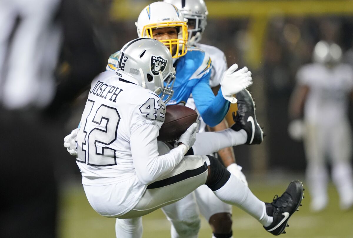 Raiders safety Karl Joseph intercepts a pass from Chargers quarterback Philip Rivers on Nov. 7.