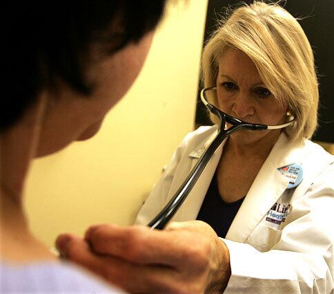 Janet Schmitt is a nurse practitioner at a walk-in clinic at a Costa Mesa Rite Aid store.
