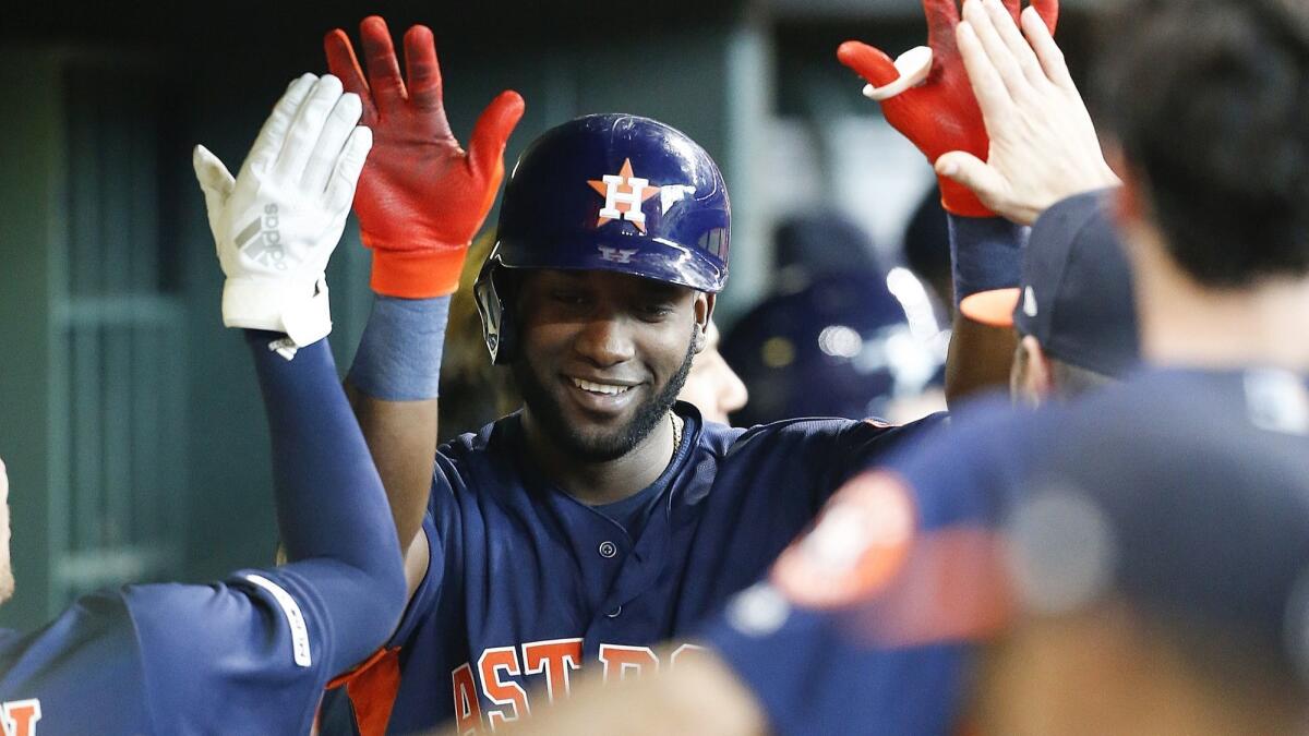 Yordan Alvarez celebrates with his Houston Astros teammates after hitting a home run against the Toronto Blue Jays on June 15.