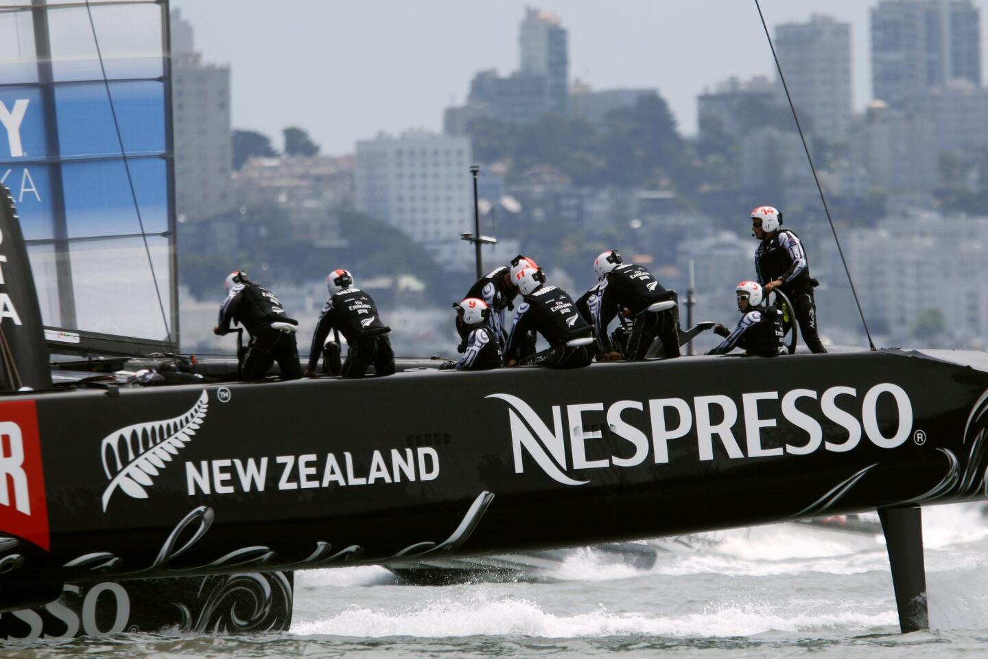 Emirates Team New Zealand sails near the city skyline during the round robin one yacht races of the Luis Vuitton Cup challenger series in the 34th America's Cup in San Francisco