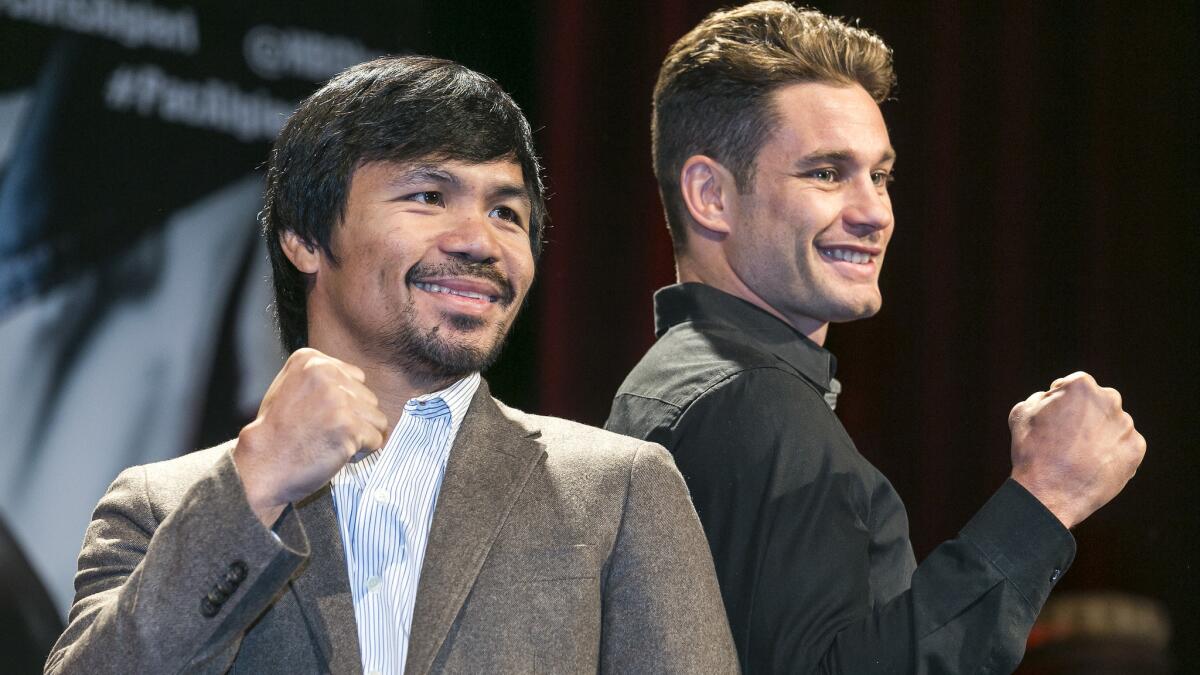 Boxers Manny Pacquiao, left, and Chris Algieri pose for photos during a news conference in Los Angeles on Wednesday. Pacquiao and Algieri are scheduled to fight in Macau on Nov. 22.