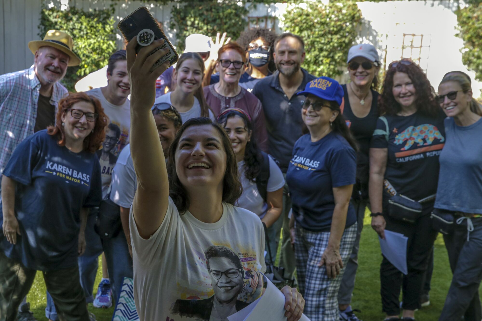 Giovanna Alves, a campaign organizer, takes a selfie with volunteers.