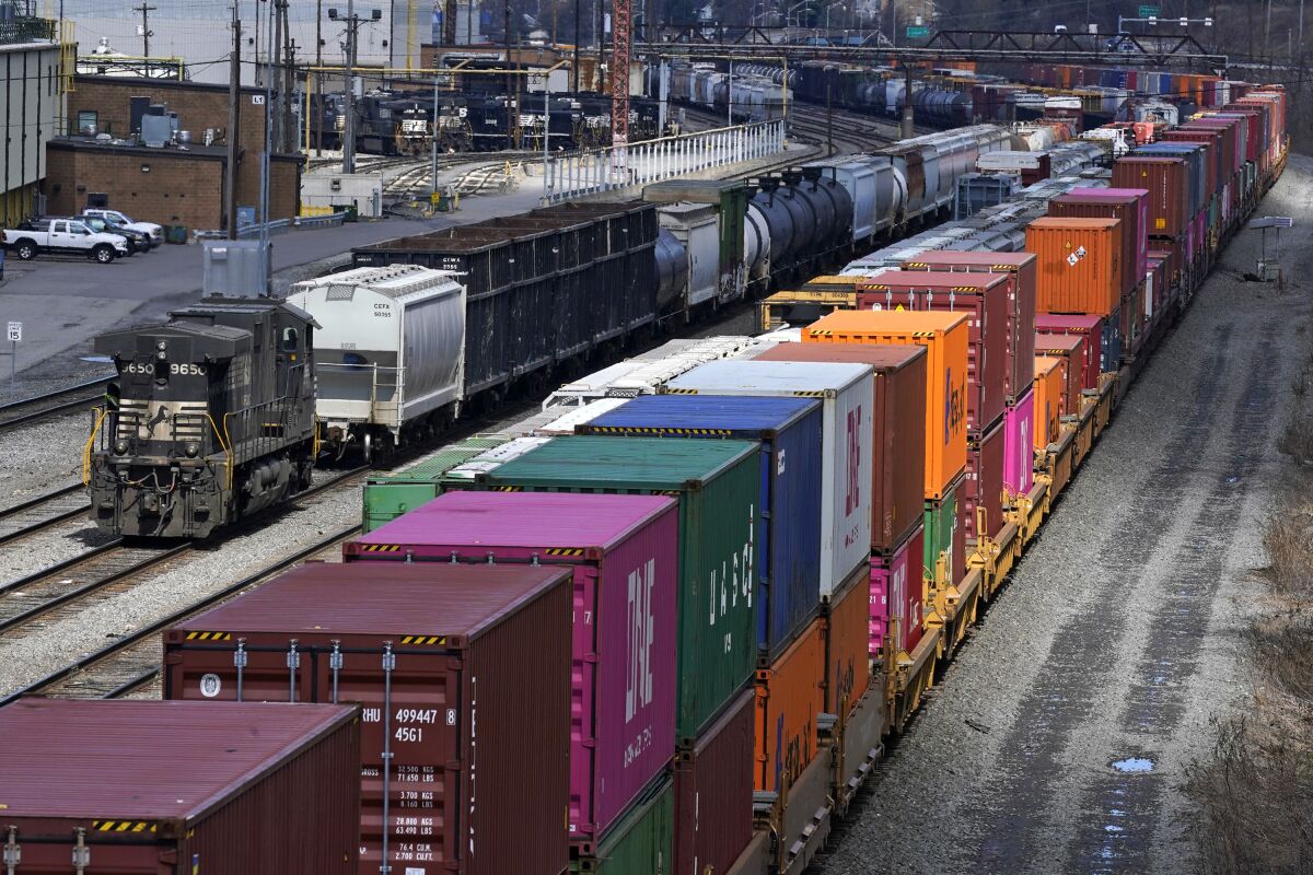 FILE - This April 2, 2021, file photo shows freight train cars and containers at Norfolk Southern Railroad's Conway Yard in Conway, Pa. On Tuesday, June 14, 2022, the National Mediation Board decided that mediation isn't working in the joint talks that cover roughly 140,000 workers in 13 unions at the biggest freight railroads that deliver the raw materials many companies rely upon and the cars, chemicals and containers full of consumer goods they make. (AP Photo/Gene J. Puskar, File)