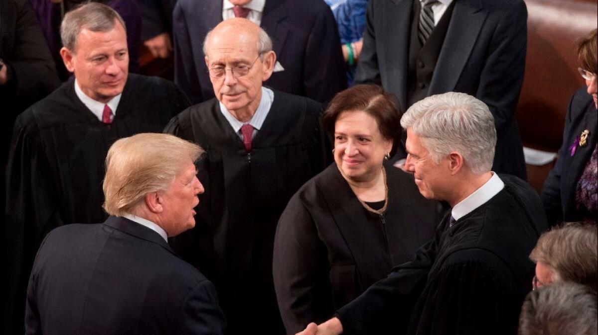 President Trump shakes hands with Justice Neil Gorsuch, alongside Chief Justice John G. Roberts Jr. and Justices Stephen Breyer and Elena Kagan, during the State of the Union Address in January.