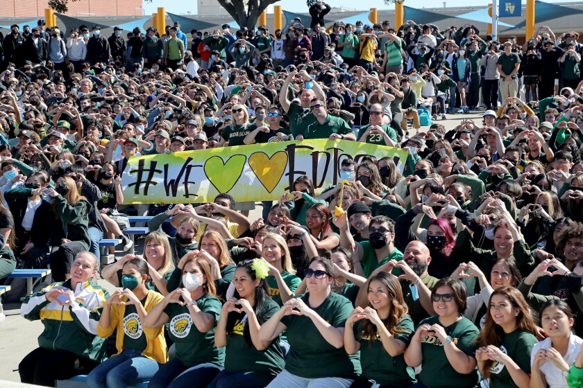 Hundreds of students and staff gather for a group picture to honor and show support for Edison brothers, Josh and Jeremy Page, during Spirit Day on Friday at Fountain Valley High School. The Page brothers past away after a fatal car accident on Monday morning at the intersection of Newland Street and Yorktown Avenue in Huntington Beach.