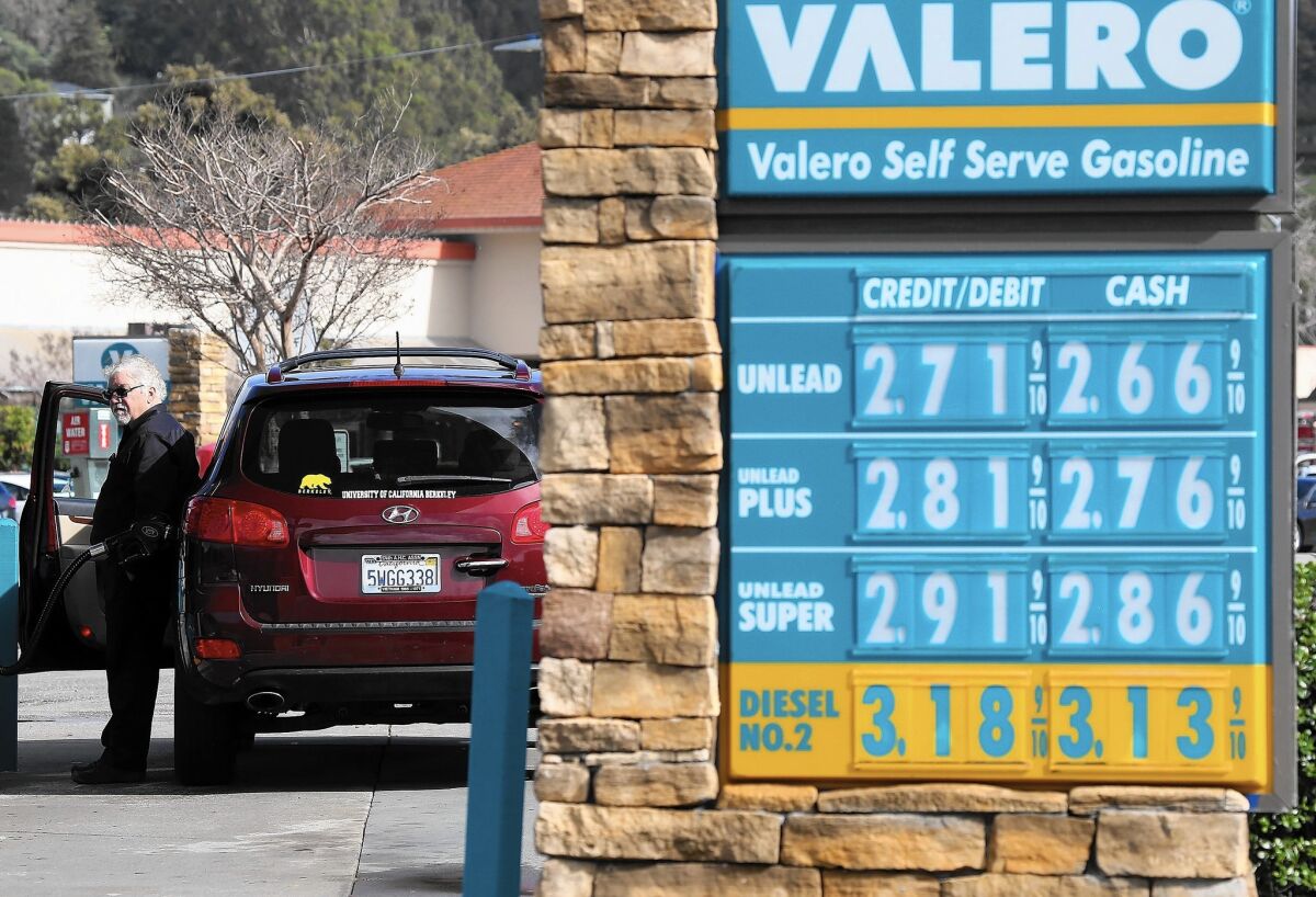 Gasoline prices are displayed at a Valero gas station in San Rafael, Calif., in February.