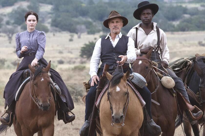 A woman and two men on horseback in the movie "Dead for a Dollar."