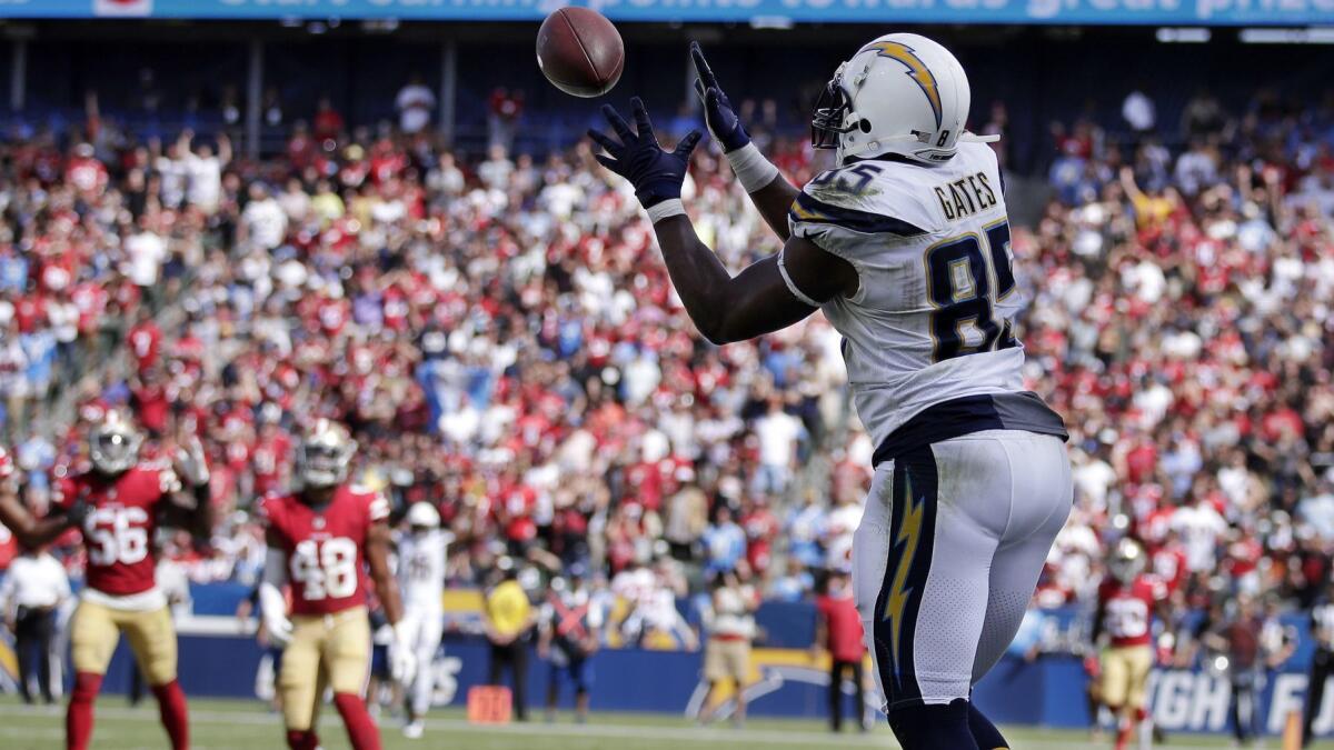 Chargers tight end Antonio Gates makes a touchdown catch against the 49ers during the first half Sunday.