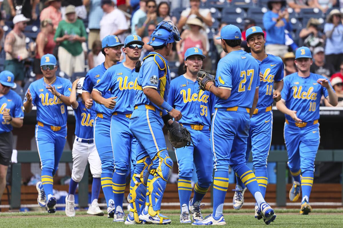 UCLA celebrates its 6-4 win against Murray State at the College World Series on Saturday.