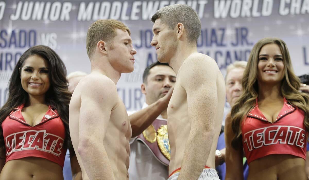 Canelo Alvarez, left, and Liam Smith are nose to nose after the official weigh-in for Saturday's title fight in Arlington, Texas.
