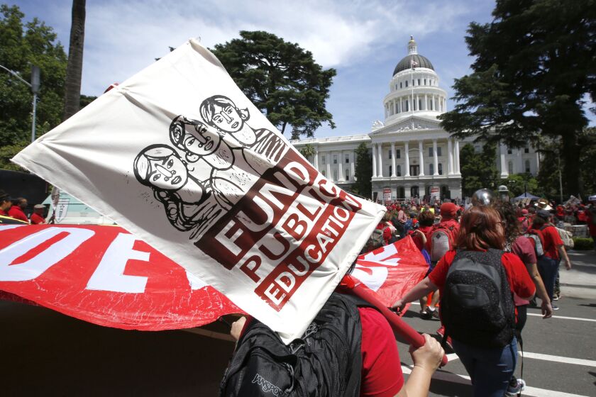 Members of the California Teachers Association and supporters of public education marched to the Capitol as part of RedForEd Day of Action Wednesday, May 22, 2019, in Sacramento, Calif. The marchers were calling on lawmakers to increase funding for public schools. On Wednesday, the state assembly narrowly passed a bill backed by teachers unions to change how charter schools are approved. (AP Photo/Rich Pedroncelli)