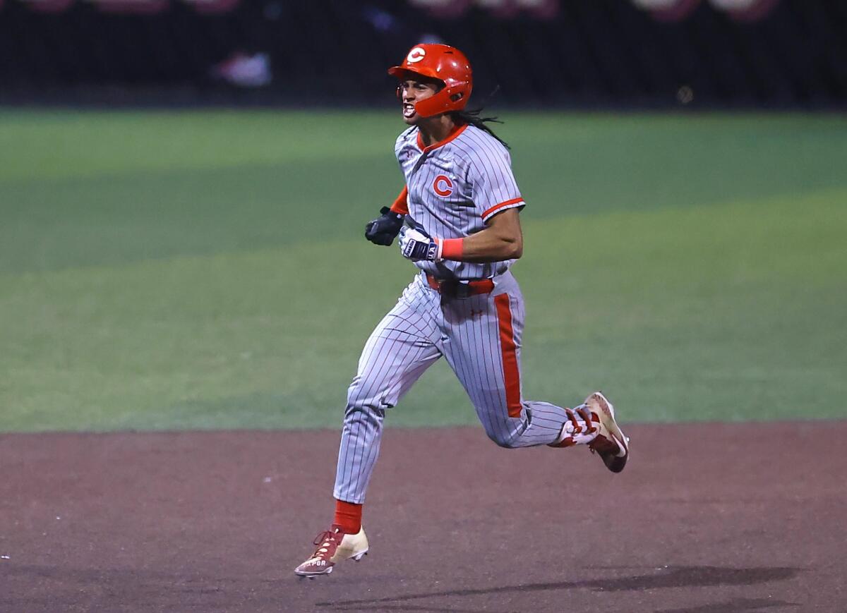Anthony Murphy of Corona rounds the base after hitting three-run home run against JSerra on Thursday night.