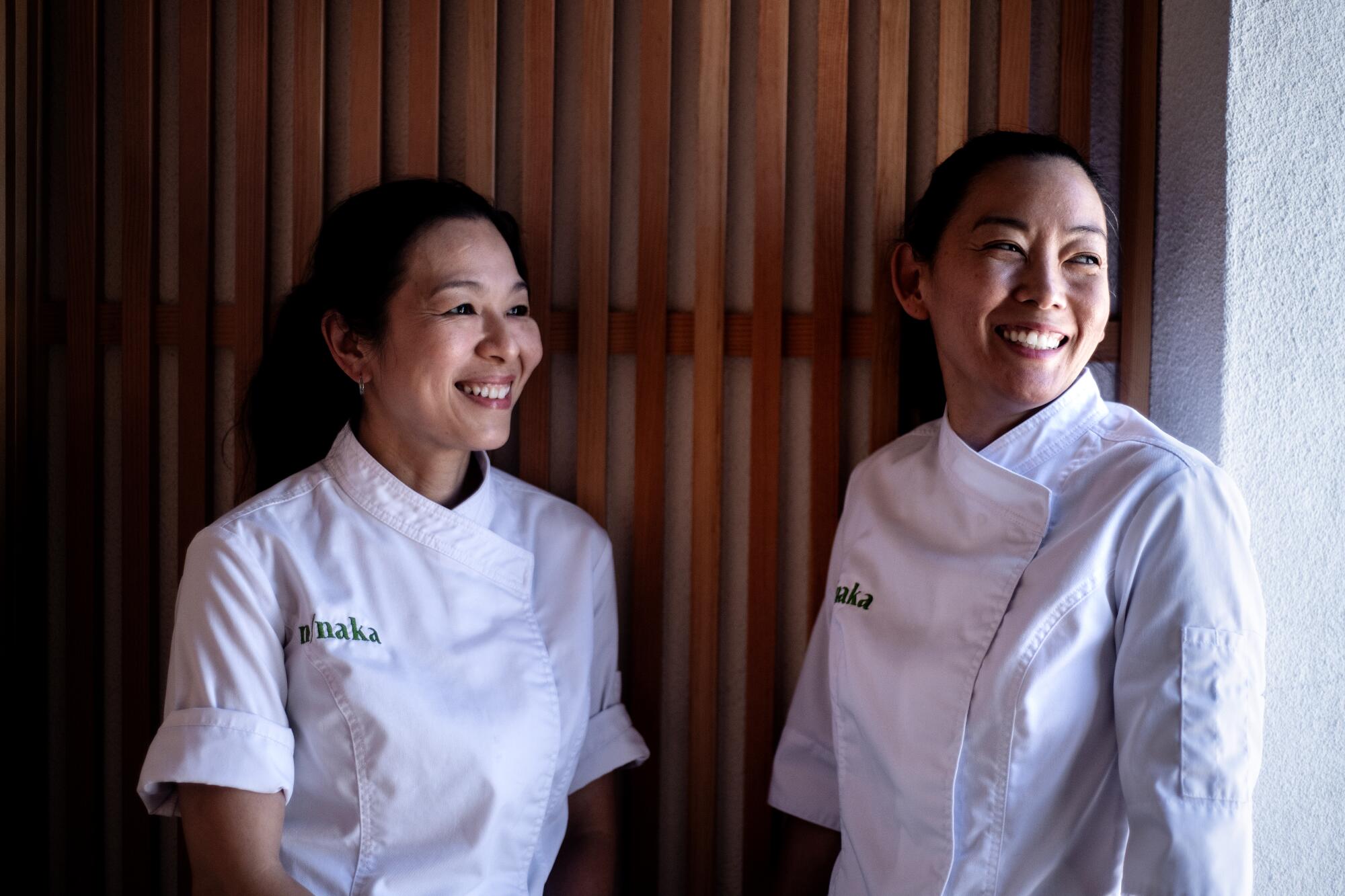 Two women in chef's tops.