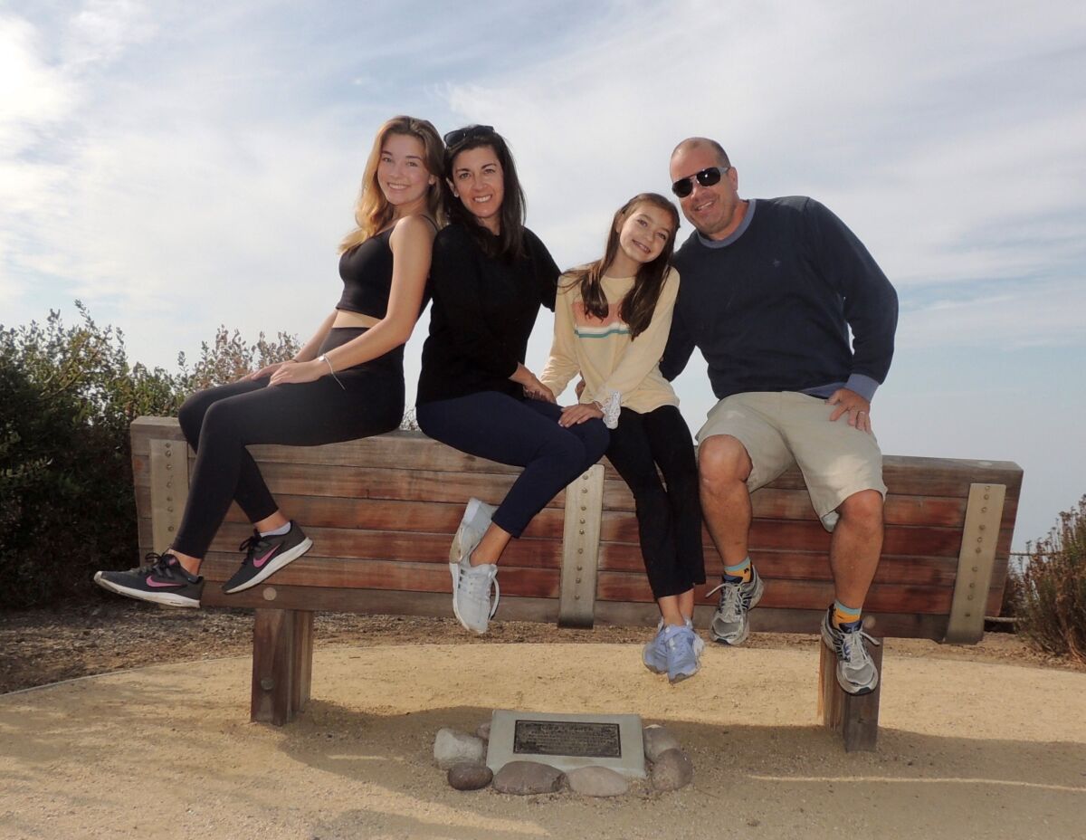Avery Wulf (left) is pictured with her mother, Theresa, sister, Devon, and father, Jeff.