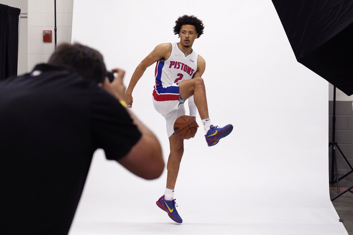 Detroit Pistons guard Cade Cunningham poses during the NBA basketball team's media day, Monday, Sept. 27, 2021, in Detroit. (AP Photo/Carlos Osorio)
