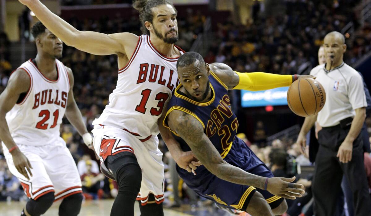 Cavaliers forward LeBron James tries to drive past Bulls center Joakim Noah during a game on April 5 in Cleveland that Chicago won, 99-94.