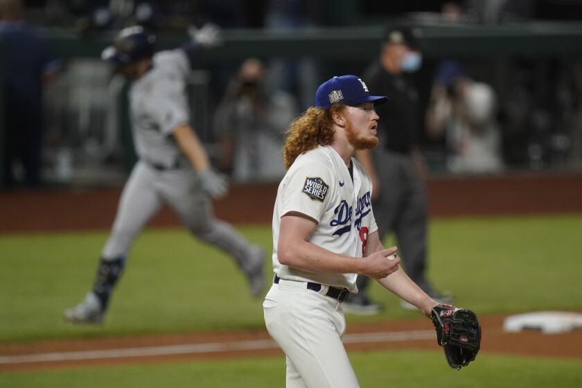 Dodgers pitcher Dustin May reacts after giving up a two-run home run to Tampa Bay's Brandon Lowe during the fifth inning.