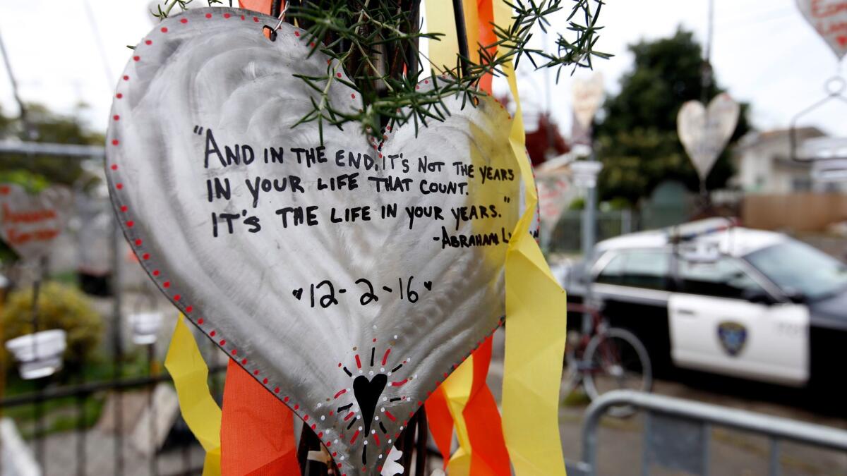 In the days after the 2016 Ghost Ship fire in Oakland, messages dedicated to victims hang near the warehouse.