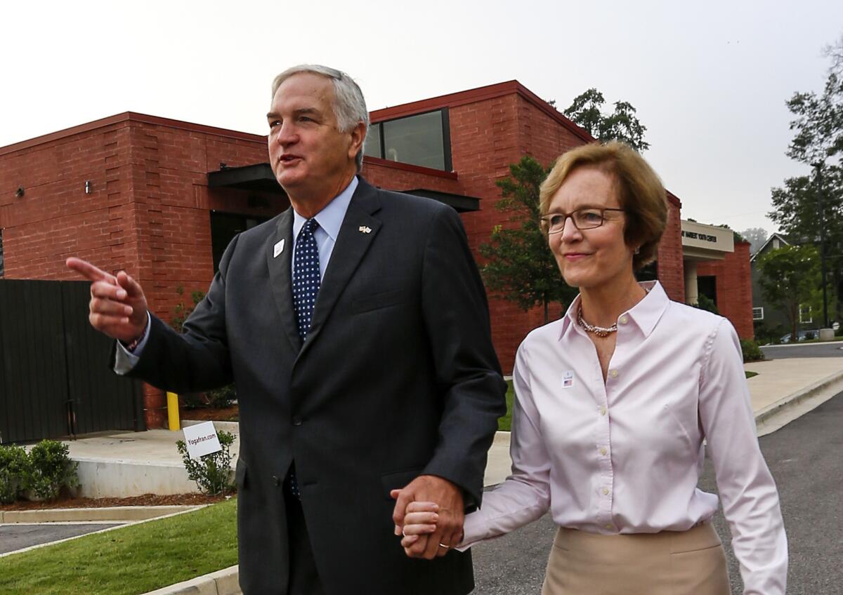 Sen. Luther Strange (R-Ala.) and his wife, Melissa, after voting Tuesday in Homewood, Ala.