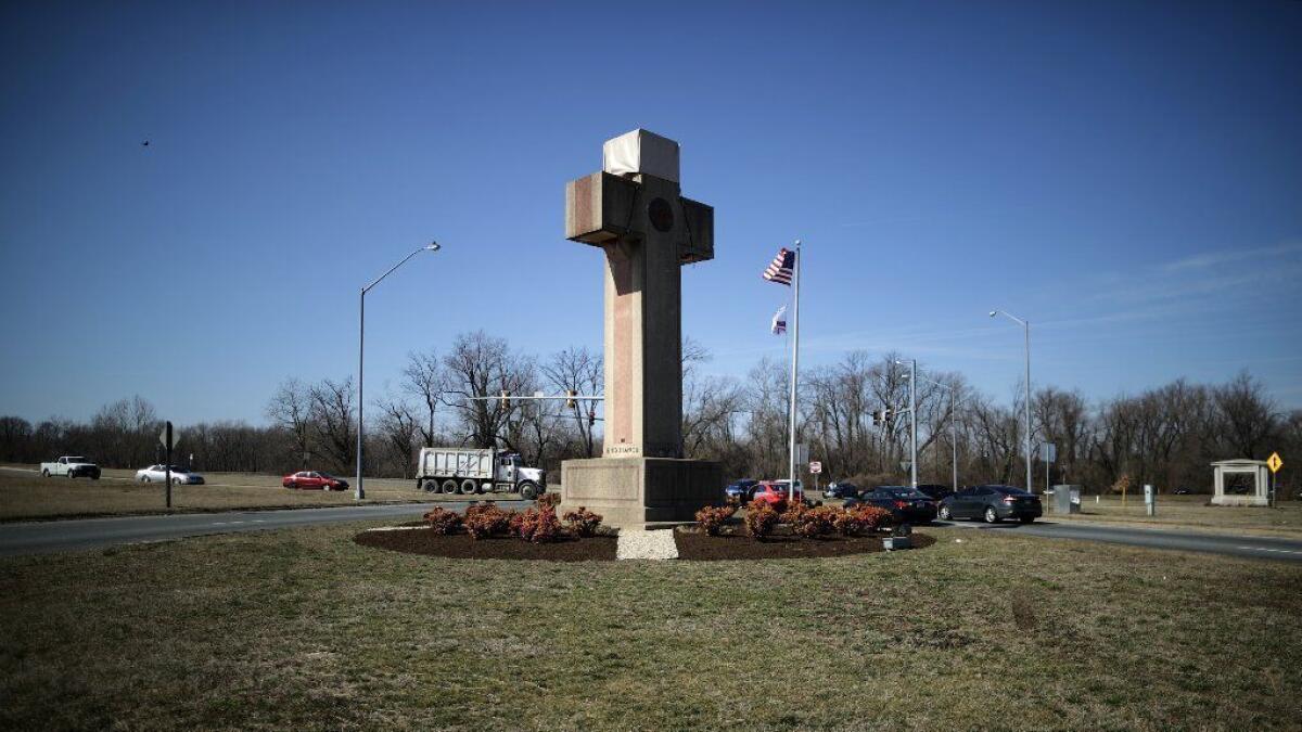 A 40-foot cross that honors 49 fallen World War I soldiers from Prince Georges County stands at a busy intersection in Bladensberg, Md.