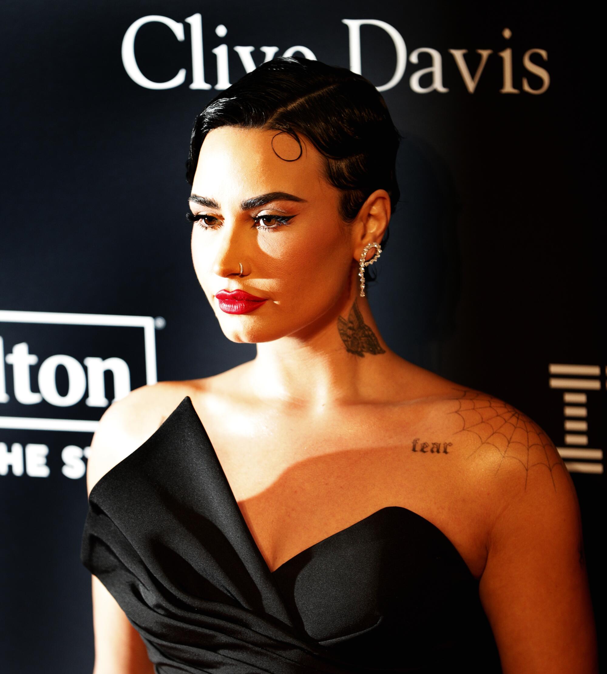 Demi Lovato walks the red carpet at the 2023 pre-Grammy gala.