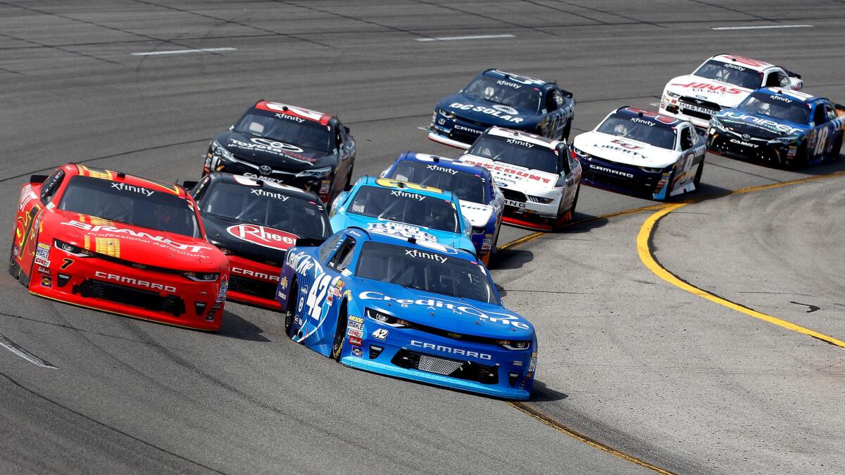 NASCAR driver Kyle Larson in the No. 42 Credit One Bank Chevrolet leads Justin Allgaier and the field through a turn during the Xfinity Series race Saturday.