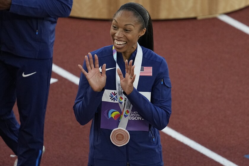 Allyson Felix smiles after winning bronze in the 4x400-meter mixed relay at the world championships on July 15.