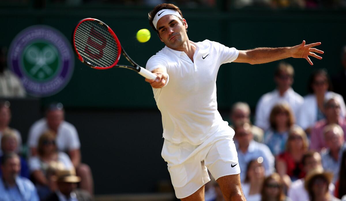 Roger Federer plays a forehand against Marin Cilic at Wimbledon on Wednesday.