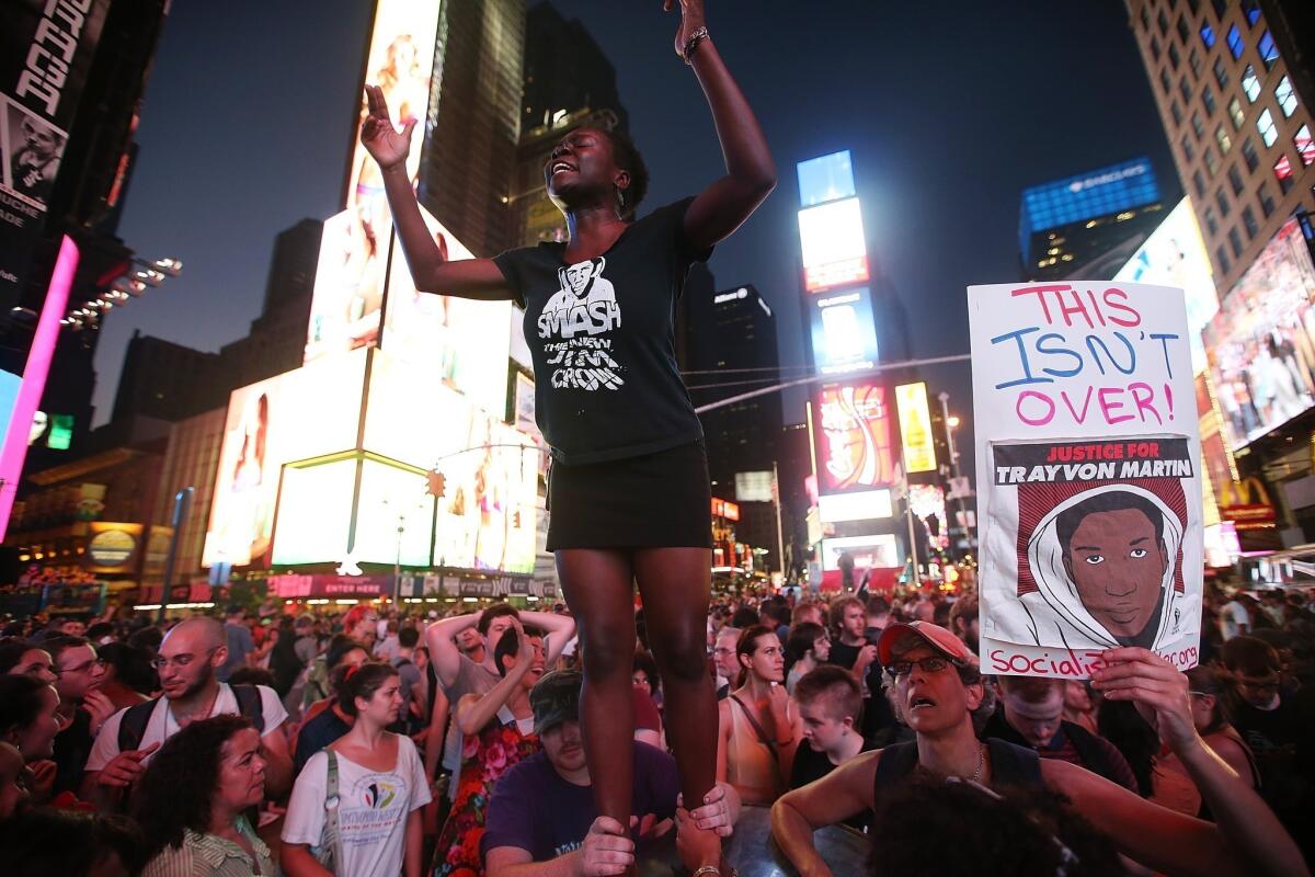 Trayvon Martin supporters rally in Times Square a day after the acquittal of George Zimmerman in the teen's death in Sanford, Fla.