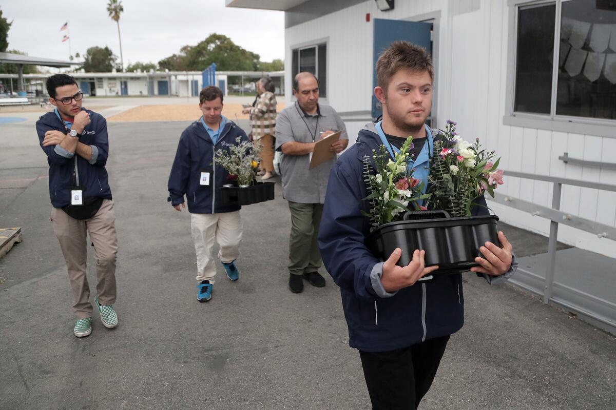 David Jamshidka, from left, walks with STEP students Reid Duarte, Connor Carone and Zeke Eampietro.