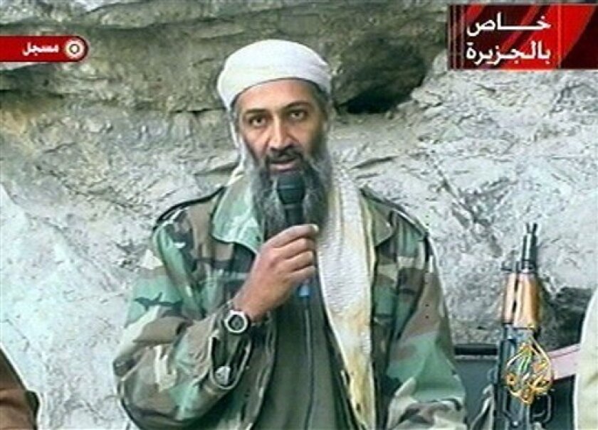 FILE - In this Oct. 7, 2011 file photo, Osama bin Laden is seen at an undisclosed location in this television image. A person familiar with developments said Sunday, May 1, 2011 that bin Laden is dead and the U.S. has the body. (AP Photo/Al Jazeera, File)