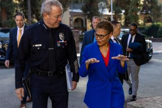 LOS ANGELES, CA - DECEMBER 07: LAPD Chief Michel Moore, left, accompanies Mayor Karen Bass at LAPD Police Academy on Thursday, Dec. 7, 2023 in Los Angeles, CA. (Irfan Khan / Los Angeles Times)