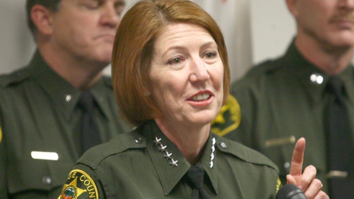 Orange County Sheriff Sandra Hutchens at a news conference in 2009. Hutchens is seeking permission from the Board of Supervisors to expand the number of federal immigration detainees who can be held in county jails.