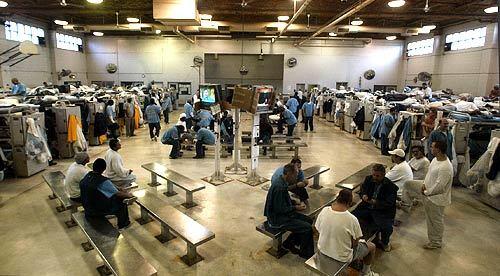 Inmates relax in a room designed to be a gym at Solano State Prison in Vacaville, California. Gov. Schwarzenegger is grappling with the escalating crisis in the state's jam-packed prisons.