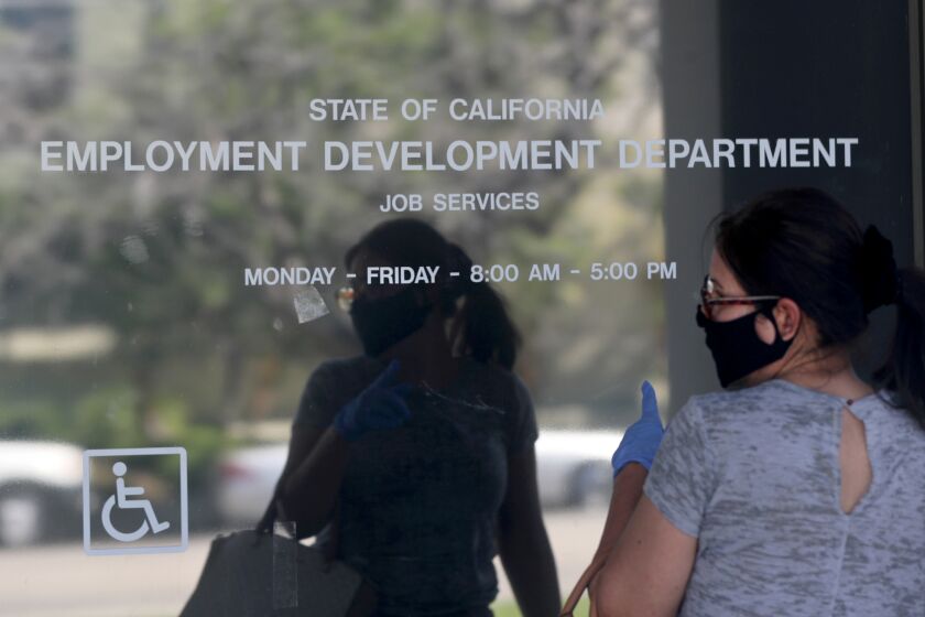 CANOGA PARK, CA - MAY 14: Maria Mora came to find information about her claim but found the California State Employment Development Department was closed due to coronavirus concerns on Thursday, May 14, 2020 in Canoga Park, CA. (Brian van der Brug / Los Angeles Times)