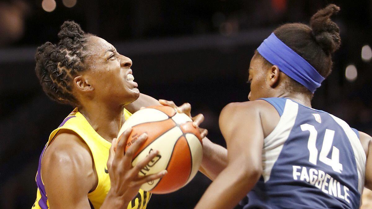 Sparks forward Nneka Ogwumike goes up for a shot against Minnesota Lynx defender Temi Fagbenle in the second quarter of an WNBA playoff game at Staples Center on Tuesday.