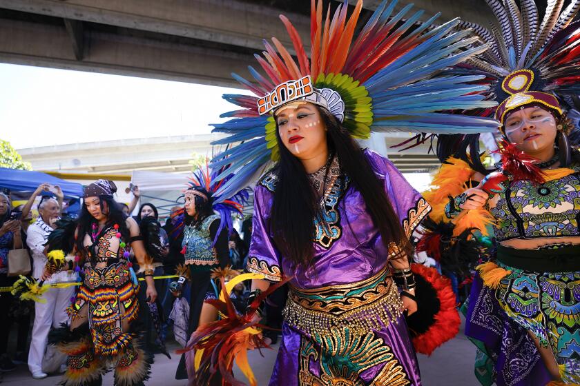 San Diego, CA - April 20: On Saturday, April 20, 2024, at the 54th Chicano Park Day commemoration, more than 150 Aztec dancers marched in towards the stage for the opening ceremony. (Nelvin C. Cepeda / The San Diego Union-Tribune)