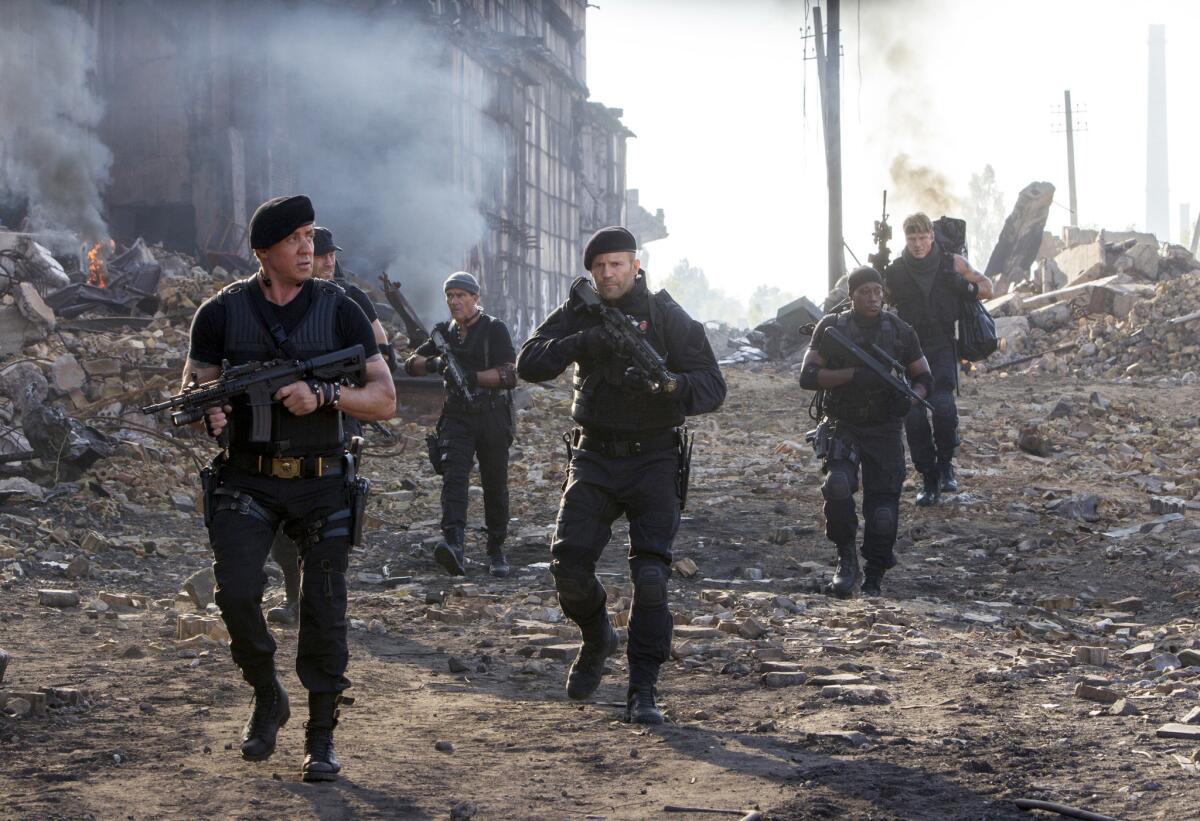 Sylvester Stallone, left, and Jason Statham, center, are two of the many big-named stars of "The Expendables 3."