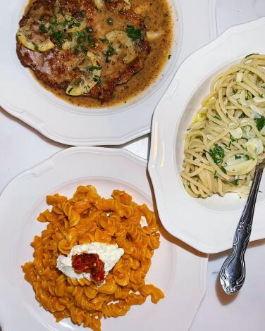 Three dishes: veal piccata, fusilli alla vodka and aglio olio from Donna's restaurant in Echo Park