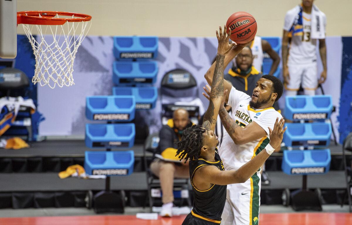 Norfolk State forward J.J. Matthews, right, shoots over Appalachian State forward RJ Duhart.