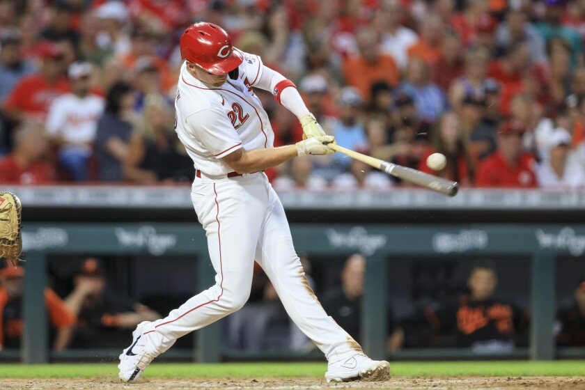 Cincinnati Reds' Brandon Drury hits an RBI-single during the sixth inning of a baseball game against the Baltimore Orioles in Cincinnati, Saturday, July 30, 2022. (AP Photo/Aaron Doster)